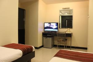 TV a/nebo společenská místnost v ubytování Hotel Fortune