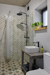 a bathroom with a shower and a sink at Апартаменты True Love с видом на горы in Uzhhorod