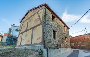 a building with a painting on the side of it at Las Morales Casa Rural 