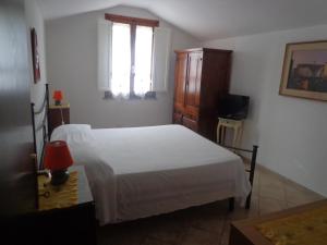 Postel nebo postele na pokoji v ubytování Agriturismo San Giuseppe