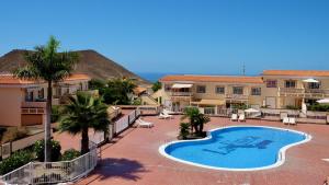 a view of a resort with a swimming pool at Atico Carlota- Feel Canarias ! in Chayofa