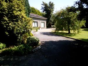 a driveway in front of a house at Spacious Contemporary Chalet type Apartment. in Galway