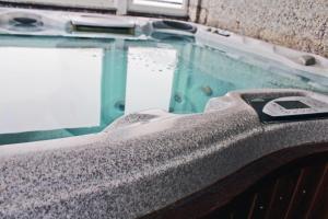 a close up of a pool of water with a remote control at Hotel Genty in Rimini