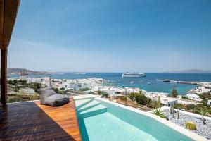 a swimming pool with a view of the ocean at Villa Nima - 2 Bedroom Villa with Private Pool & Sea View, Mykonos Town in Klouvas