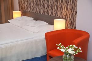 Postel nebo postele na pokoji v ubytování Hotel IKAR
