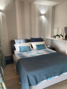 Ένα ή περισσότερα κρεβάτια σε δωμάτιο στο Magnolie Garda