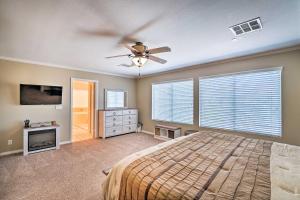 a bedroom with a bed and a ceiling fan at about 3,900 Sq Ft North Vegas Escape with RV Parking! in Las Vegas