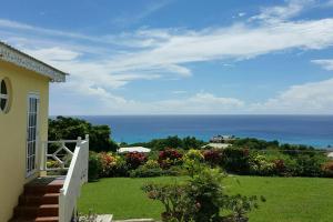 a view of the ocean from a house at Spectacular Ocean View Retreat in Saint James