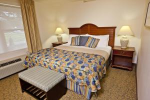 A bed or beds in a room at Oceancliff I & II, a VRI resort