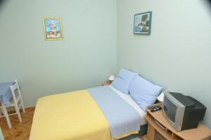 Postel nebo postele na pokoji v ubytování Studio Vodice 4172c
