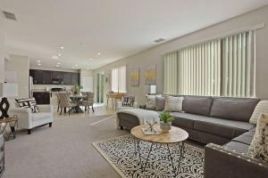 a living room with a couch and a table at Stunning River Islands Home Near Lake & Boat House in Lathrop