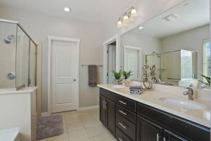 a bathroom with a sink and a large mirror at Stunning River Islands Home Near Lake & Boat House in Lathrop +27 photos