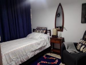Postel nebo postele na pokoji v ubytování Los Cacicazgos Apart Estudio