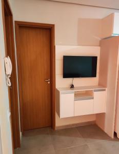 TV a/nebo společenská místnost v ubytování Casa na praia com piscina