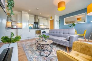 a living room with a couch and a table at Stylish 2 bed flat in Basingstoke By 20Property Stays Short Lets & Serviced Accommodation in Basingstoke