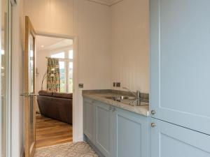 a bathroom with a sink and a bath tub at Karelia Lodge in Kenmore