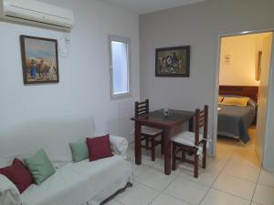 a living room with a couch and a table at Caseros Centro in San Juan