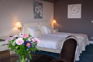 Postel nebo postele na pokoji v ubytování First Euroflat Hotel