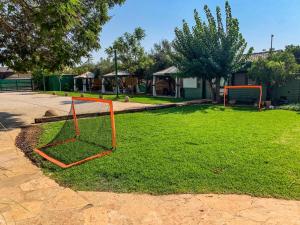 an orange goal in a park with a playground at Song of Galilee in Elifelet