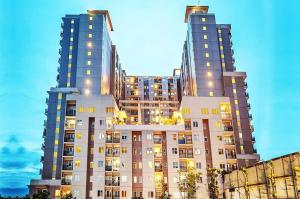 two tall buildings next to each other at Cottonwood Apartment at Sudirman Suites Bandung 5-pax in Bandung