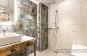 a bathroom with a sink and a shower at Newmond Hotel in Seoul