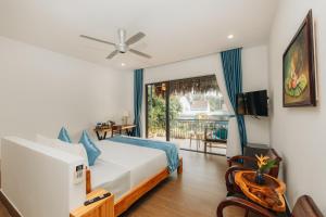 a hotel room with a bed and a balcony at Ngoc An Bang Villa in An Bang