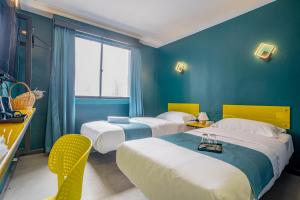 Postel nebo postele na pokoji v ubytování Hotel 28 Chow Kit Kuala Lumpur