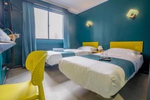 Postel nebo postele na pokoji v ubytování Hotel 28 Chow Kit Kuala Lumpur