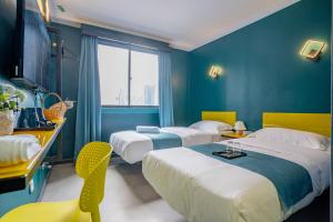 Postel nebo postele na pokoji v ubytování Hotel 28 Chow Kit Kuala Lumpur