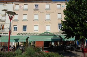 a building with a sign on the side of it at Hôtel Restaurant La Belle Epoque in Le Creusot