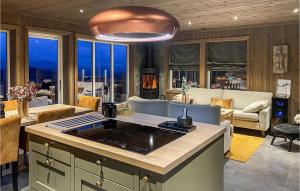 a kitchen with a island in a living room at Awesome Home In Rauland With Wifi in Rauland