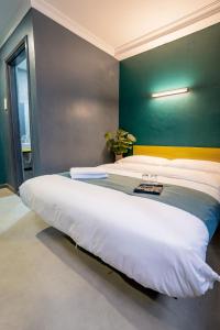 Postel nebo postele na pokoji v ubytování Hotel 28 Chow Kit Kuala Lumpur