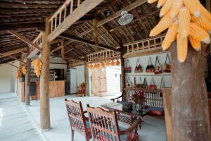 a dining room with a table and chairs in a building at Bong Bang homestay 2 in Na Hang