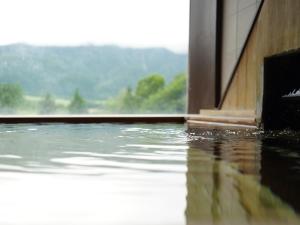 a pool of water on the floor of a building at Hotel Onikoube in Osaki