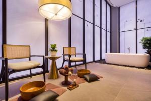 Postel nebo postele na pokoji v ubytování M Resort & Hotel Kuala Lumpur