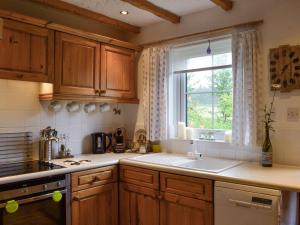 A cozinha ou cozinha compacta de Haagwood Cottage