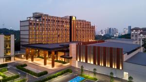 a large building with lights on in a city at M Resort & Hotel Kuala Lumpur in Kuala Lumpur