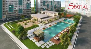 an aerial view of a building with a swimming pool at D' Centro Inn in Davao City