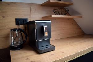 Příslušenství pro přípravu čaje a kávy v ubytování Apartmány Pod Novou