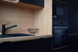 Kuchyň nebo kuchyňský kout v ubytování Apartmány Pod Novou