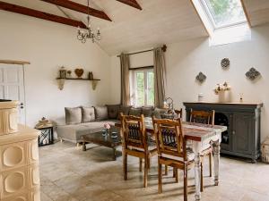 a living room with a table and a couch at Bungalov Trapani in Růžová