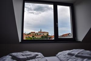 Postel nebo postele na pokoji v ubytování Apartmány Pod Novou
