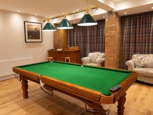 a living room with a pool table in it at Deneville in Heighington