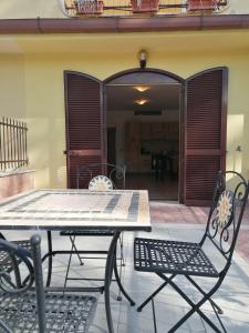 a table and chairs sitting on a patio at La Casa di Golia in Bagni San Filippo