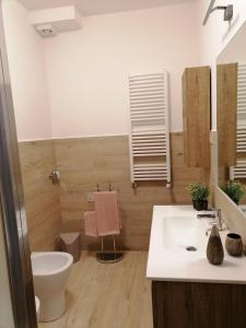 a bathroom with a sink and a toilet at La Casa di Golia in Bagni San Filippo