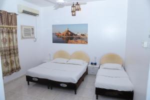 Letto o letti in una camera di Nima guest house