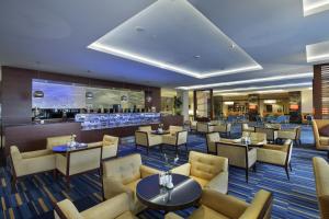 a restaurant with tables and chairs and a bar at TUl BLUE Side Adult Only 16 Plus - Ultra All Inclusive in Side