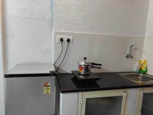 Cucina o angolo cottura di Mysore Studio Rooms
