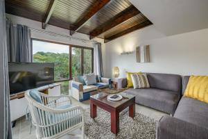 Ruang duduk di San Lameer Villa 3107 - 4 Bedroom Classic - 8 pax - San Lameer Rental Agency