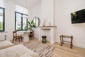 TV in/ali zabaviščno središče v nastanitvi Quartier Le Sud